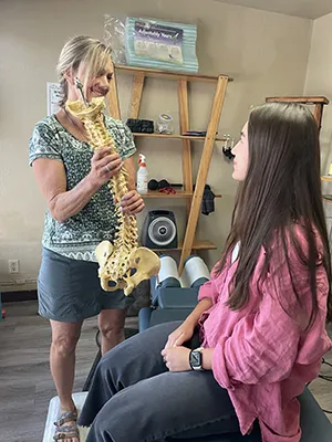 Chiropractor Spokane WA Gina Yaritz With Patient